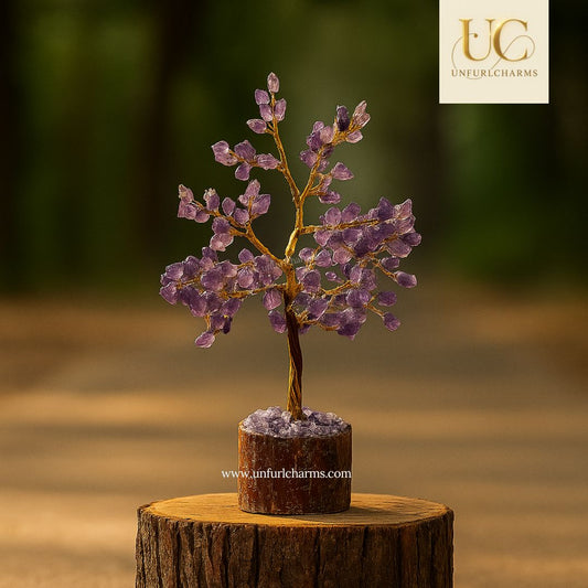 Amethyst crystal tree on a wooden base with a blurred background and 'Uneful Charms' branding.